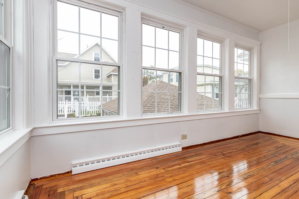 1 May Court Methuen, MA 01844 - Photo 31 of 40 a view of an empty room with wooden floor and a window