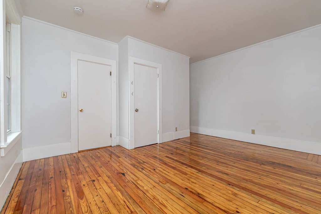1 May Court Methuen, MA 01844 - Photo 34 of 40 a view of empty room with wooden floor