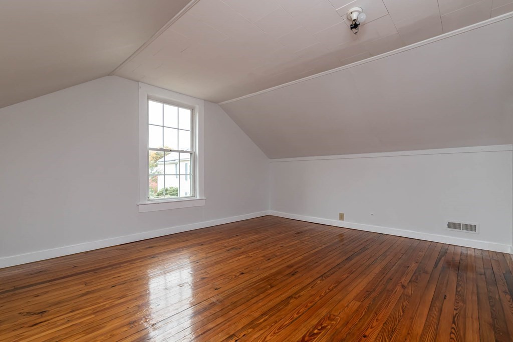 1 May Court Methuen, MA 01844 - Photo 36 of 40 an empty room with wooden floor and windows