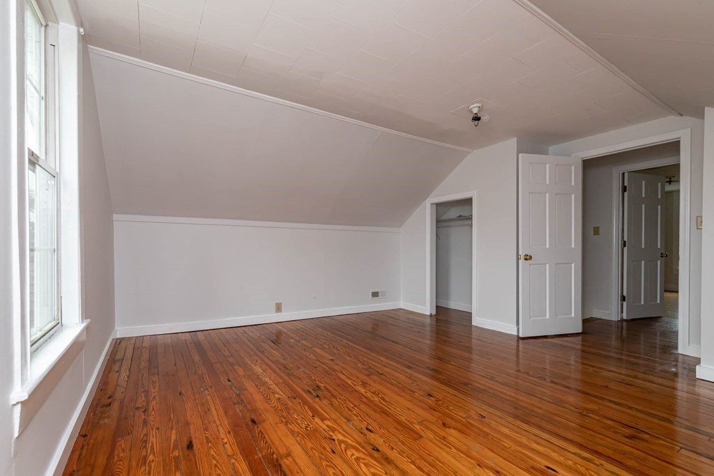 1 May Court Methuen, MA 01844 - Photo 37 of 40 a view of an empty room with wooden floor and a window