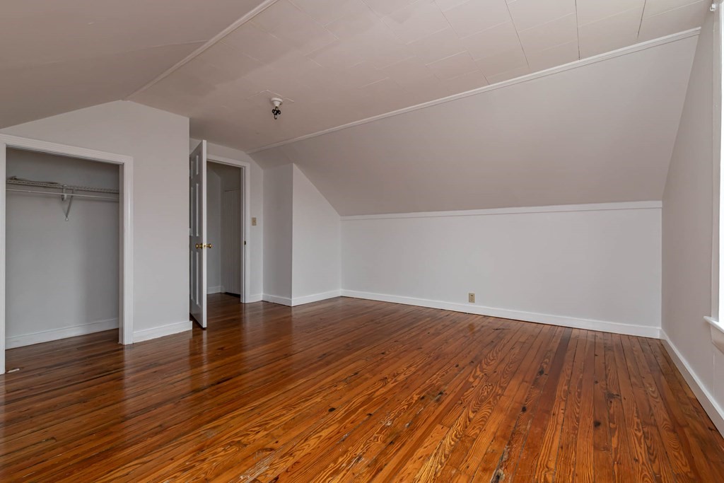 1 May Court Methuen, MA 01844 - Photo 38 of 40 wooden floor in an empty room with a window