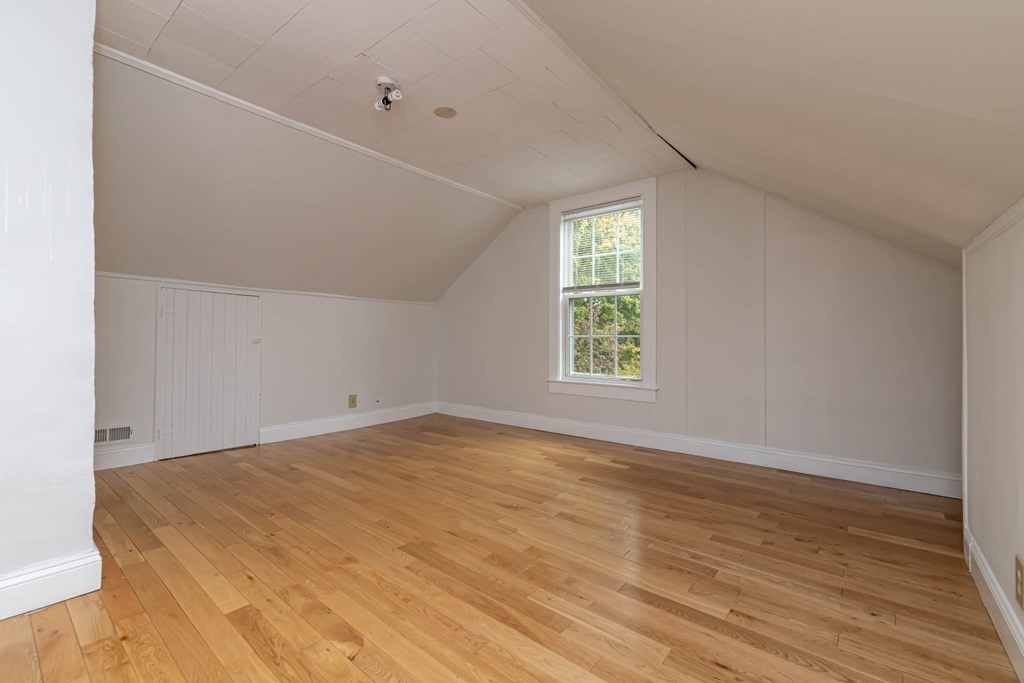 1 May Court Methuen, MA 01844 - Photo 39 of 40 an empty room with wooden floor and windows