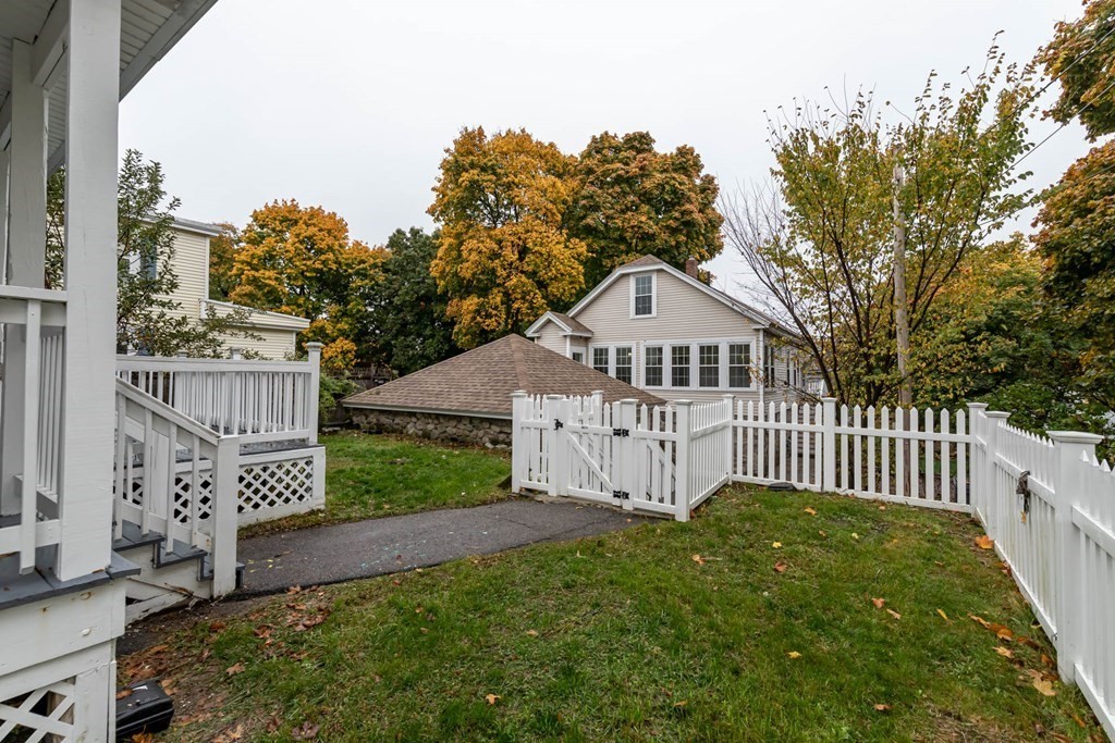 1 May Court Methuen, MA 01844 - Photo 5 of 40 a view of a house with a small yard and a garden