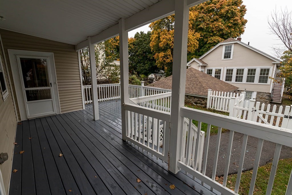 1 May Court Methuen, MA 01844 - Photo 6 of 40 a view of a wooden deck and city view