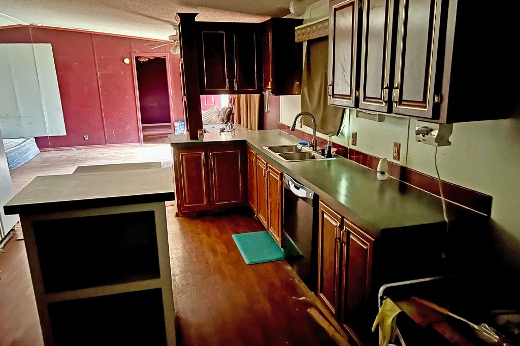 231 Beaver Lane Waco, TX 76705 - Photo 2 of 5 a kitchen with a sink stove and cabinets