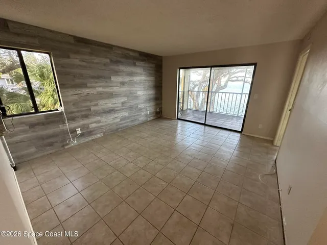 a bathroom with a granite countertop sink toilet mirror vanity and shower