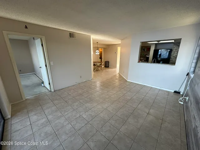 a view of a street with a building in the background