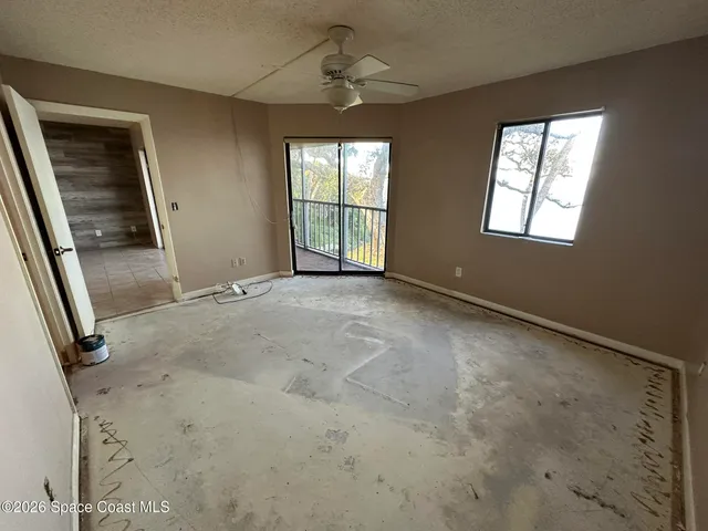 a view of a balcony with chairs