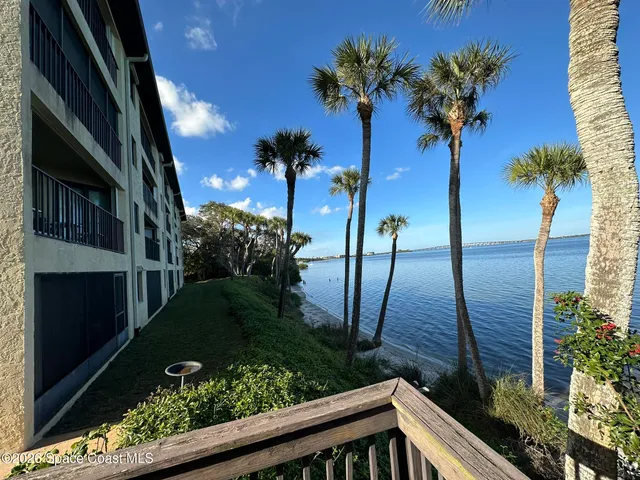 a view of an empty room and a window