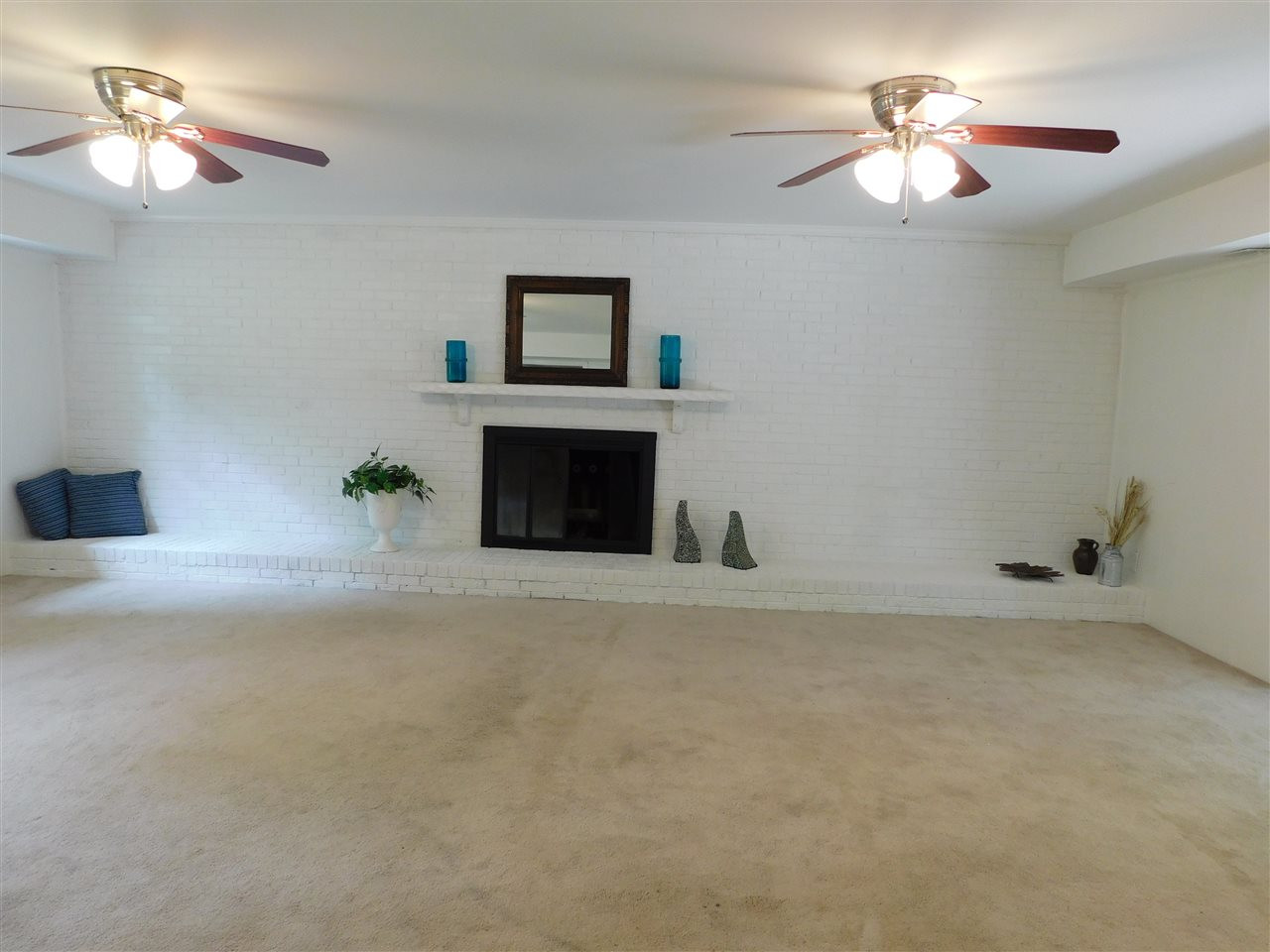 5704 Partridge Lane Raleigh, NC 27609 - Photo 22 of 28 Beautiful fireplace in lower level den