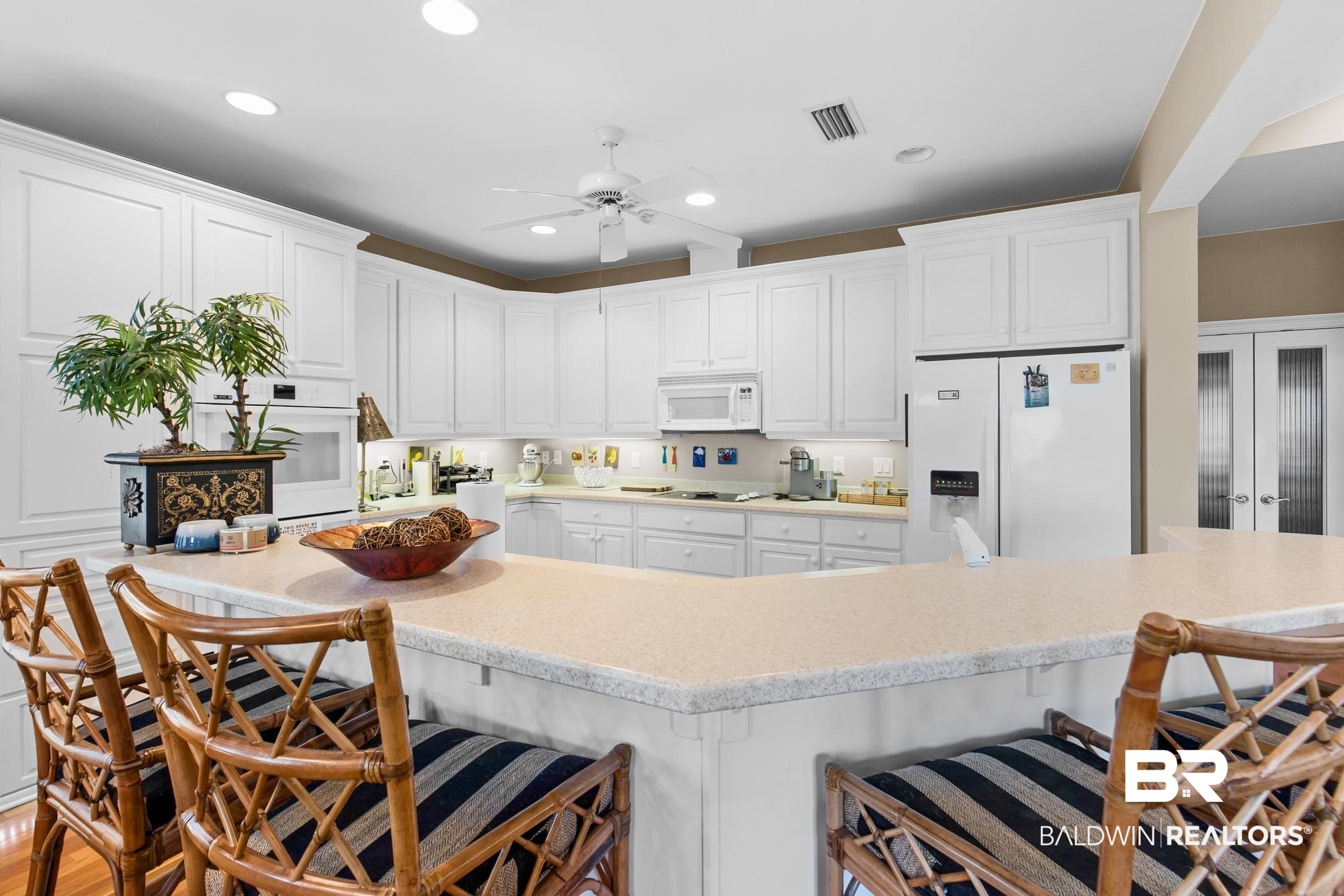 32191 River Road Orange Beach, AL 36561 - Photo 14 of 46 Kitchen featuring a breakfast bar area, white cabinets, white appliances, a ceiling fan, and recessed lighting