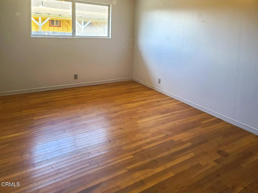 375 South Corry Street Fort Bragg, CA 95437 - Photo 11 of 34 a view of an empty room with wooden floor and a window