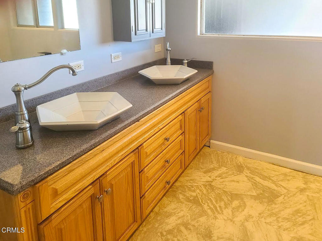 375 South Corry Street Fort Bragg, CA 95437 - Photo 14 of 34 a bathroom with a sink and a mirror