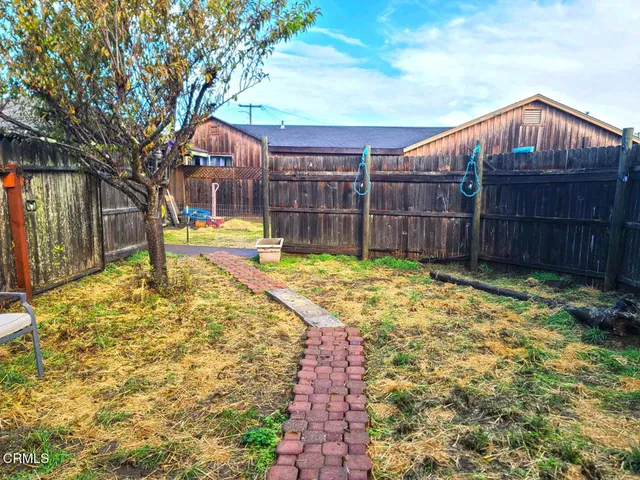a view of a backyard with a small cabin