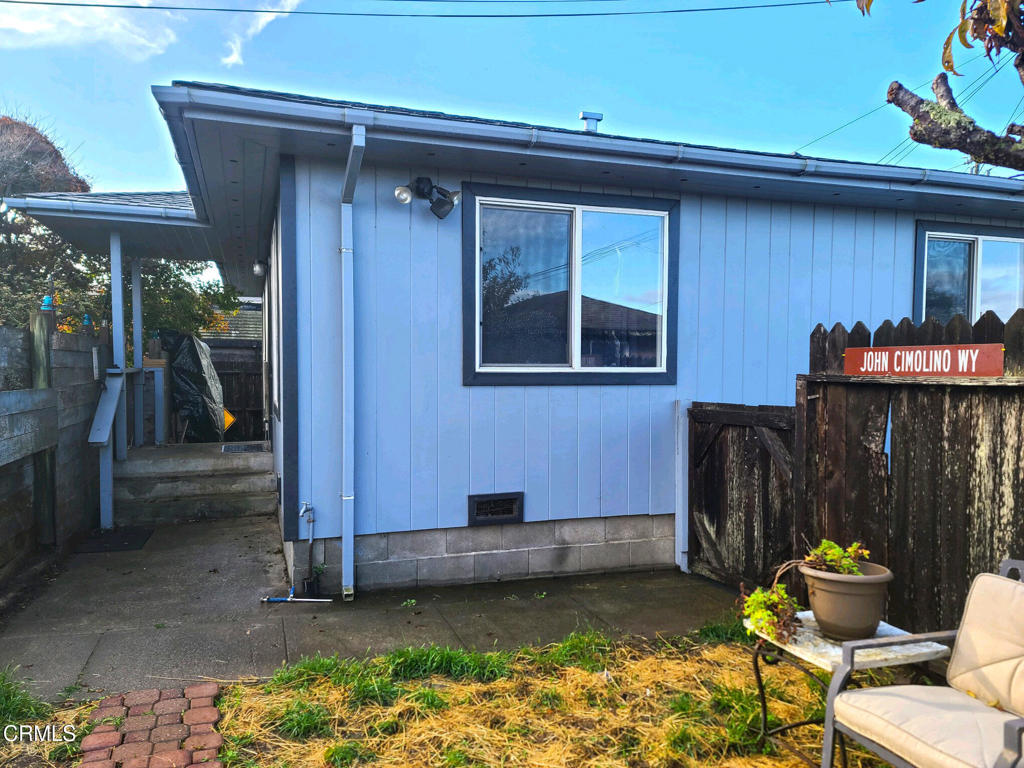 375 South Corry Street Fort Bragg, CA 95437 - Photo 21 of 34 a backyard of a house with chairs and a table