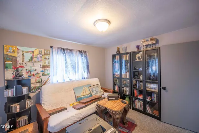 a bedroom with furniture and a window