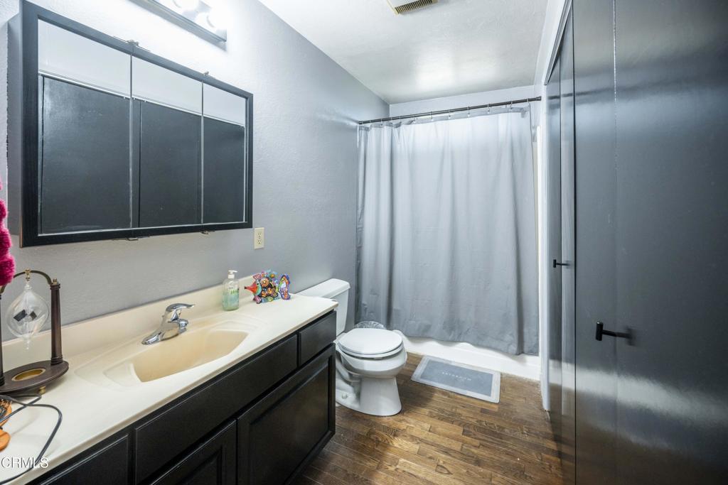 375 South Corry Street Fort Bragg, CA 95437 - Photo 30 of 34 a bathroom with a sink toilet mirror and shower