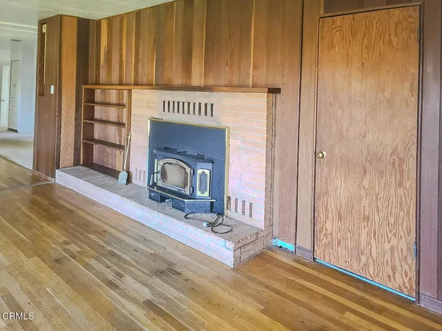 a front view of a house with wooden floor