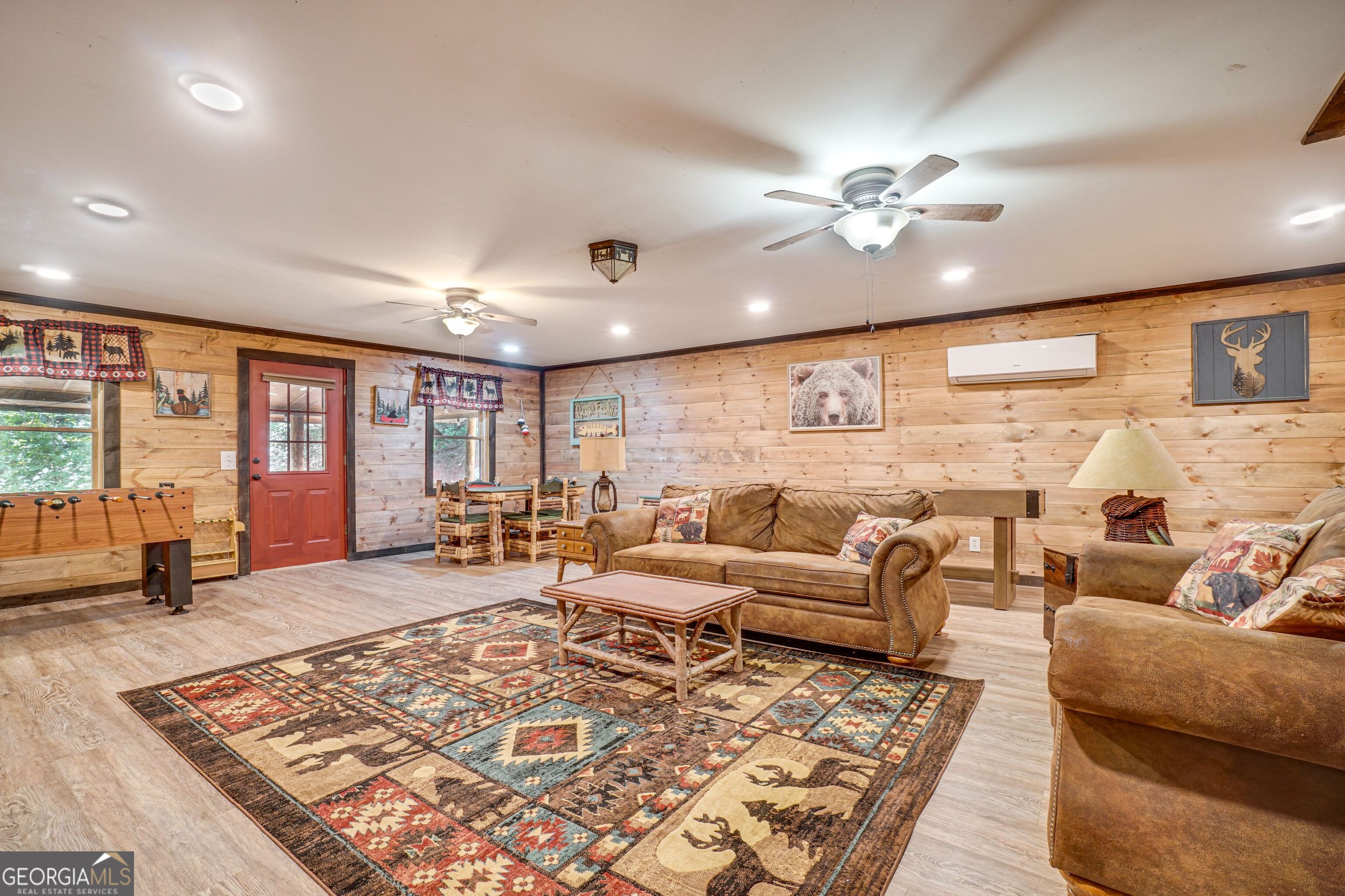 2183 Chimney Mountain Road Sautee Nacoochee, GA 30571 - Photo 15 of 28 a living room with furniture ceiling fan and a rug