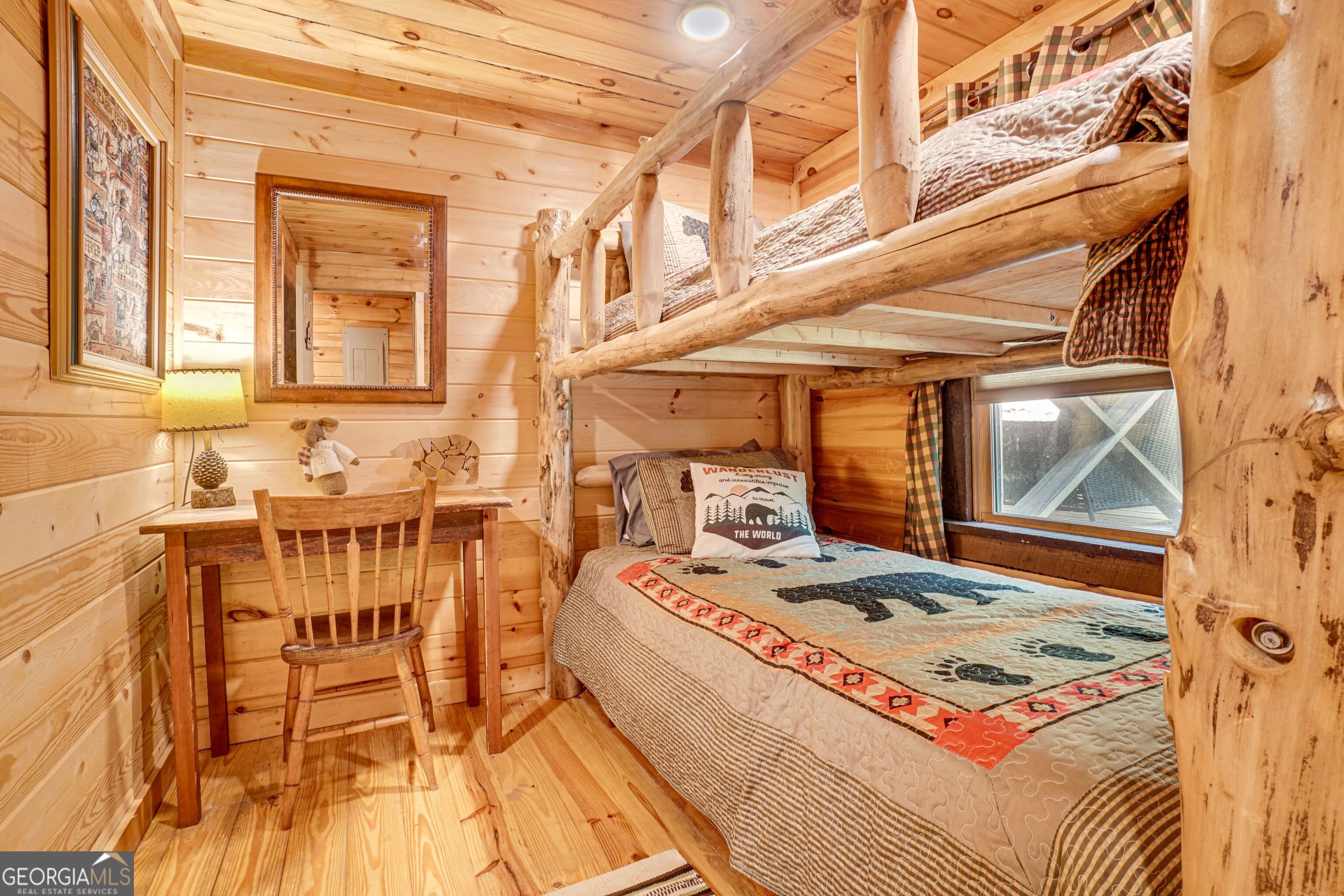 2183 Chimney Mountain Road Sautee Nacoochee, GA 30571 - Photo 19 of 28 a bedroom with a bed and a table