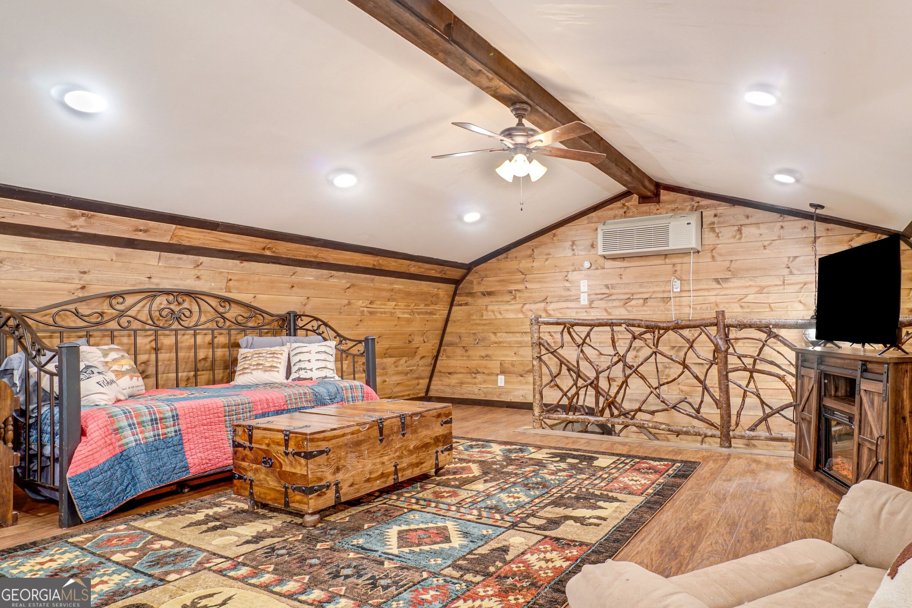 2183 Chimney Mountain Road Sautee Nacoochee, GA 30571 - Photo 21 of 28 a living room with a couch and a flat screen tv