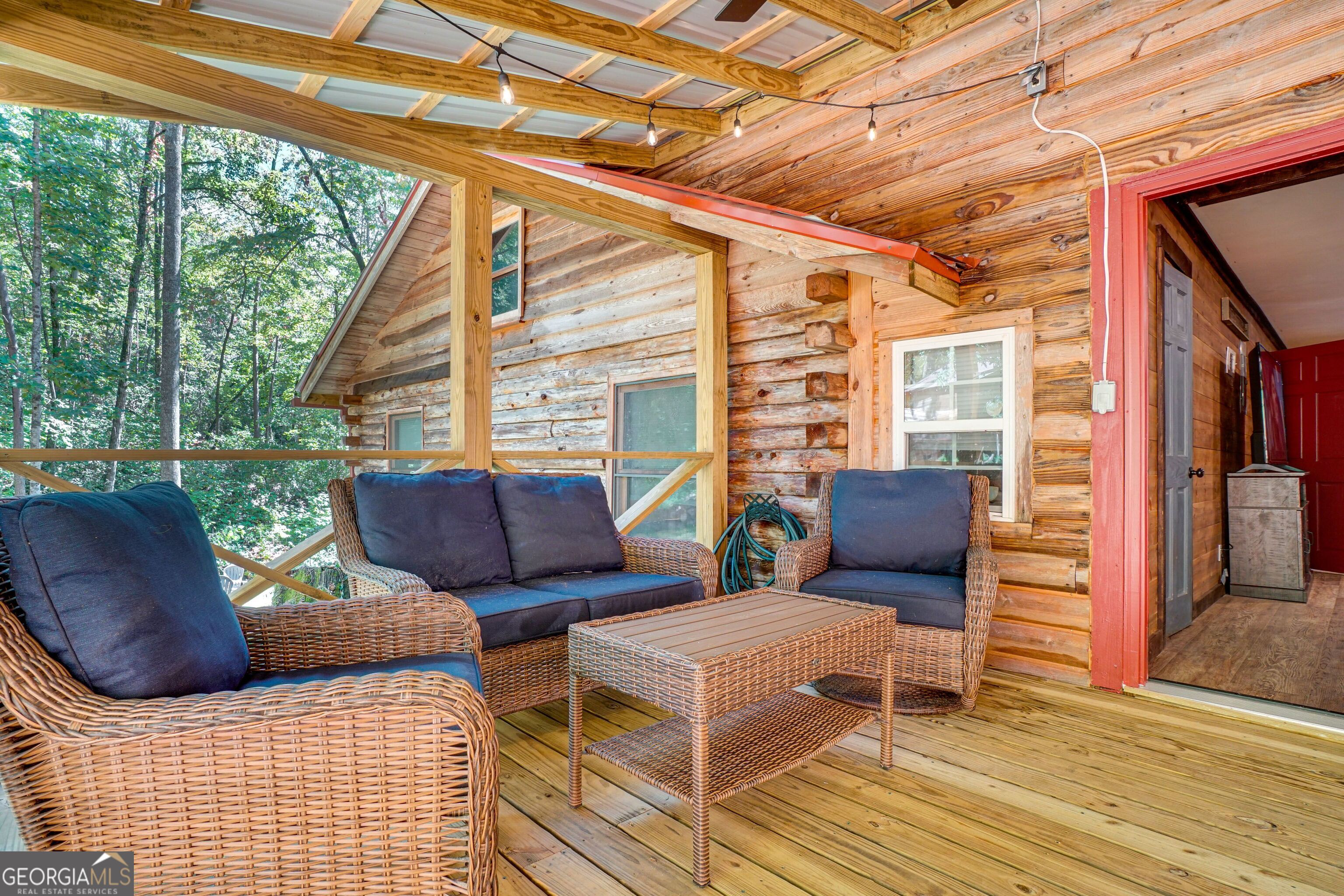 2183 Chimney Mountain Road Sautee Nacoochee, GA 30571 - Photo 24 of 28 a couch sitting in front of a building