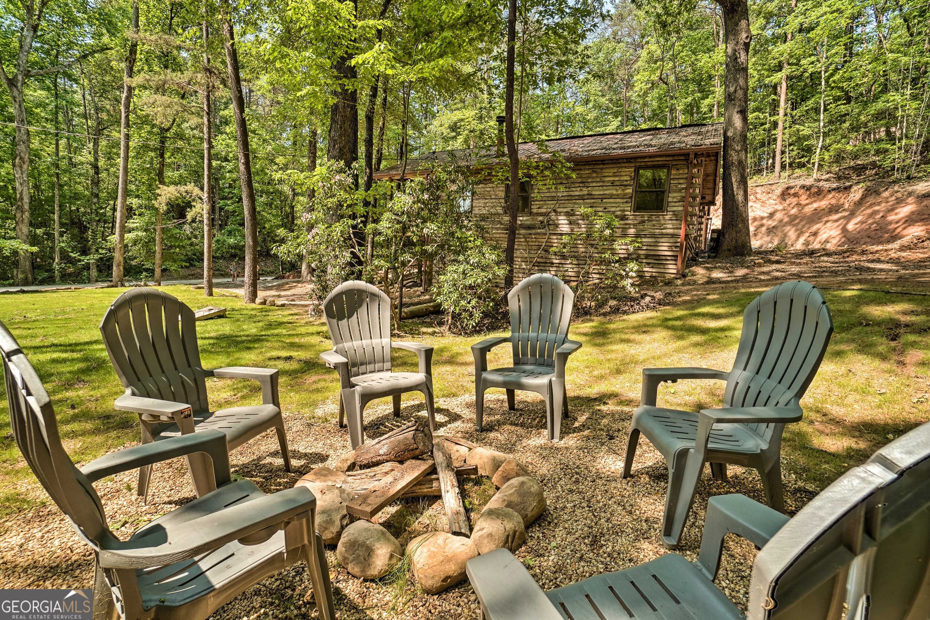 2183 Chimney Mountain Road Sautee Nacoochee, GA 30571 - Photo 27 of 28 a view of a chairs and table in the patio