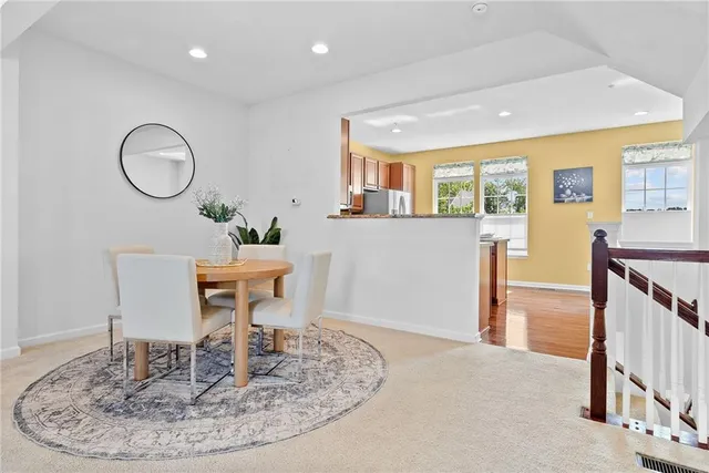 a view of a livingroom with furniture window and wooden floor