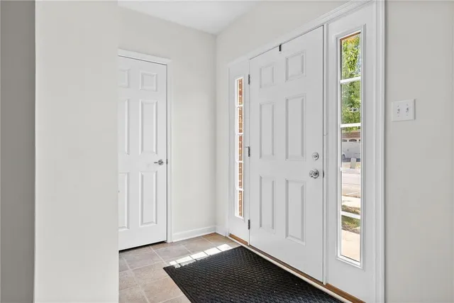 a view of an entryway with wooden floor