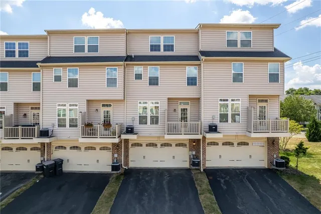 a view of a patio with table and chairs and potted plants