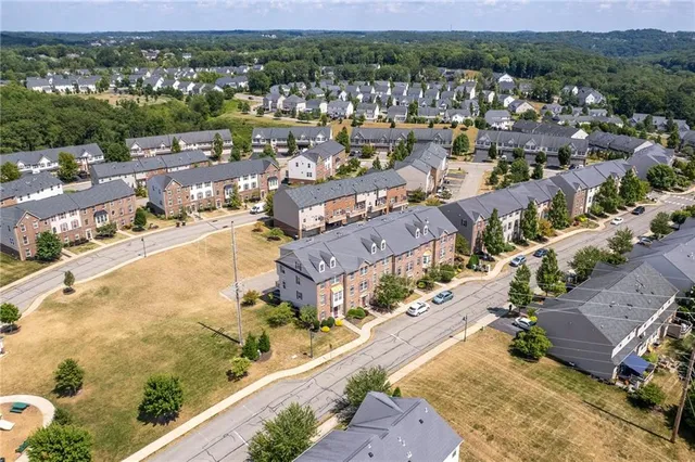 a picture of a bench in front of a wall