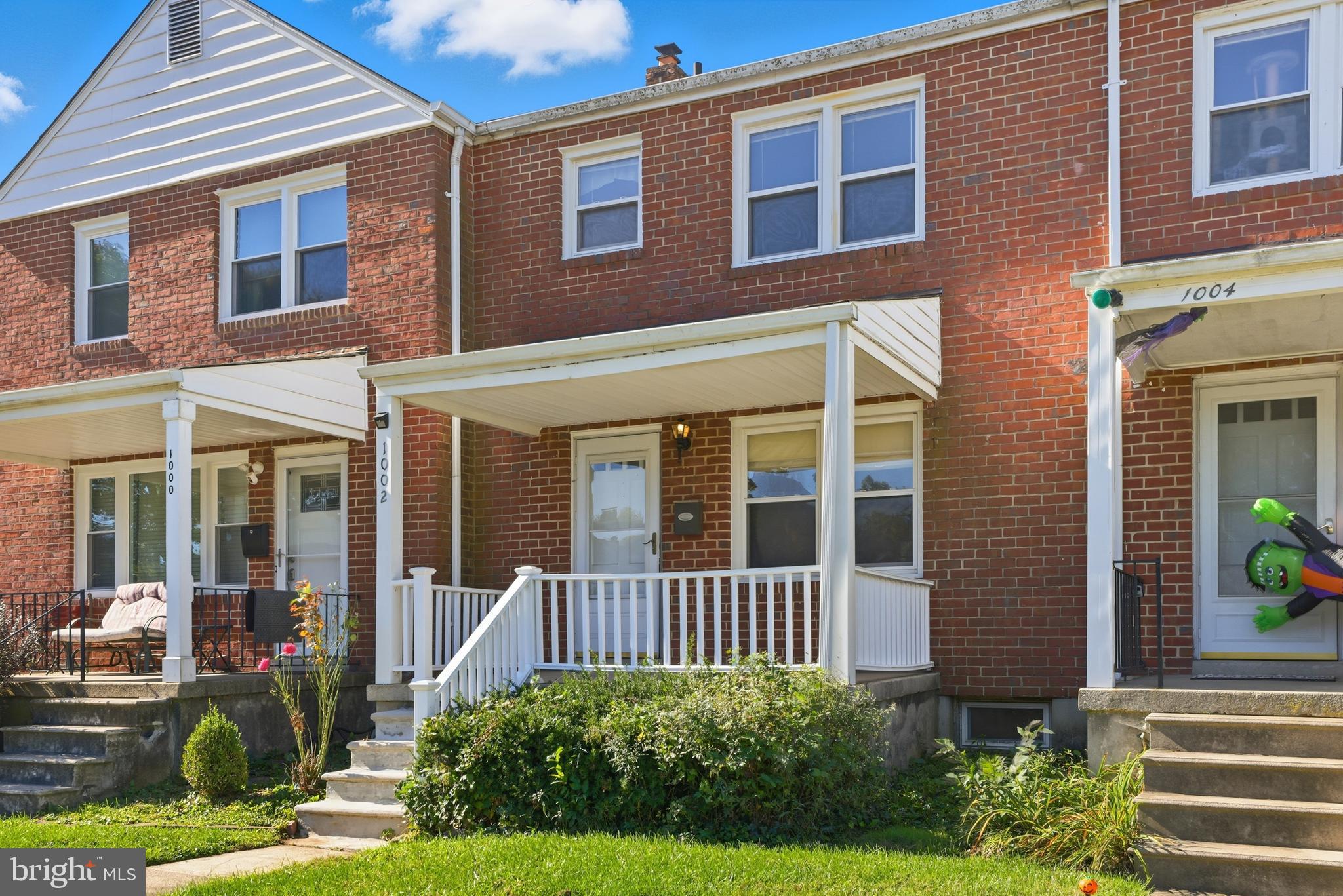 1002 Winsford Road Baltimore, MD 21204 - Photo 2 of 30 a view of a brick house with a yard