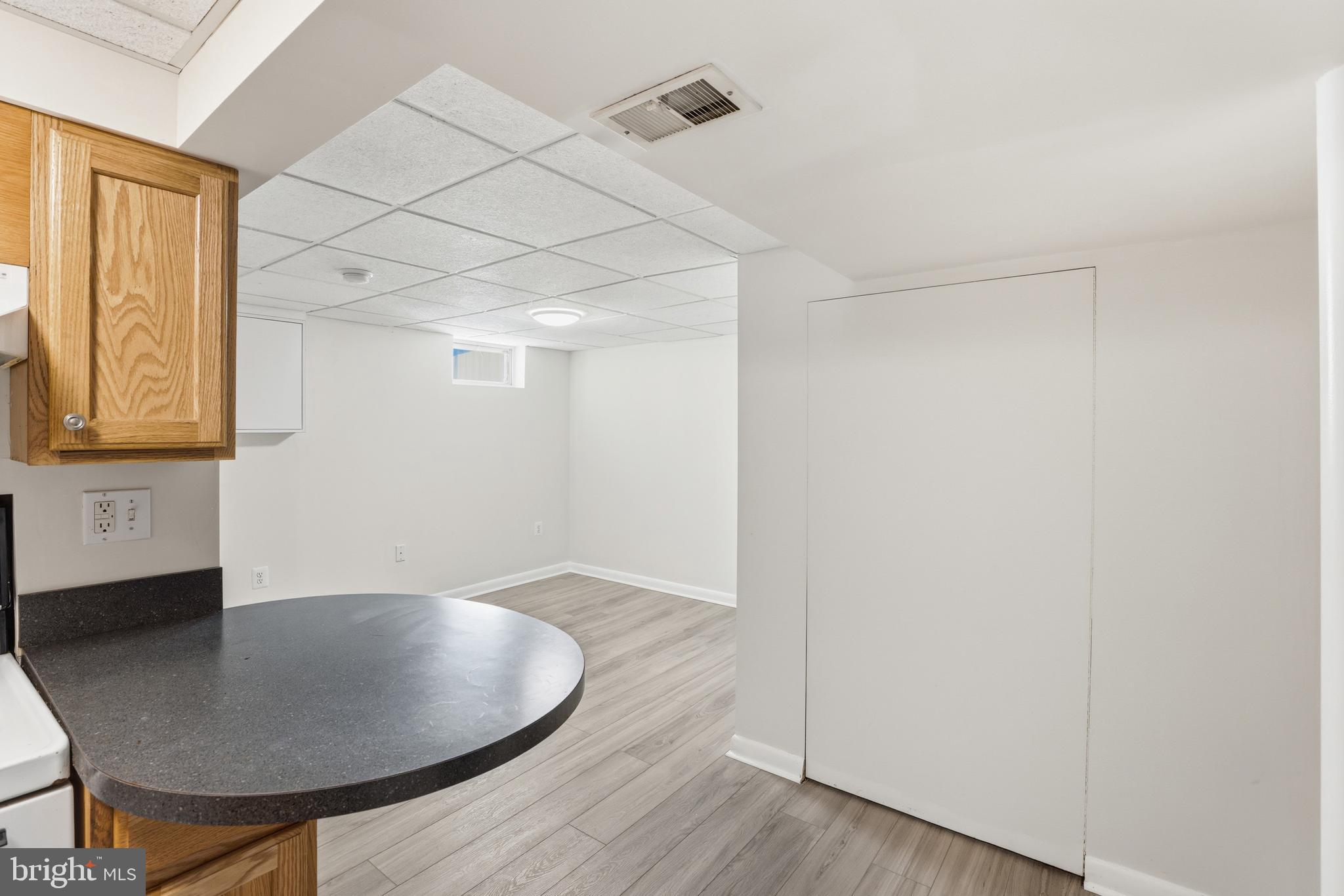 1002 Winsford Road Baltimore, MD 21204 - Photo 24 of 30 a workspace room with wooden floor and windows