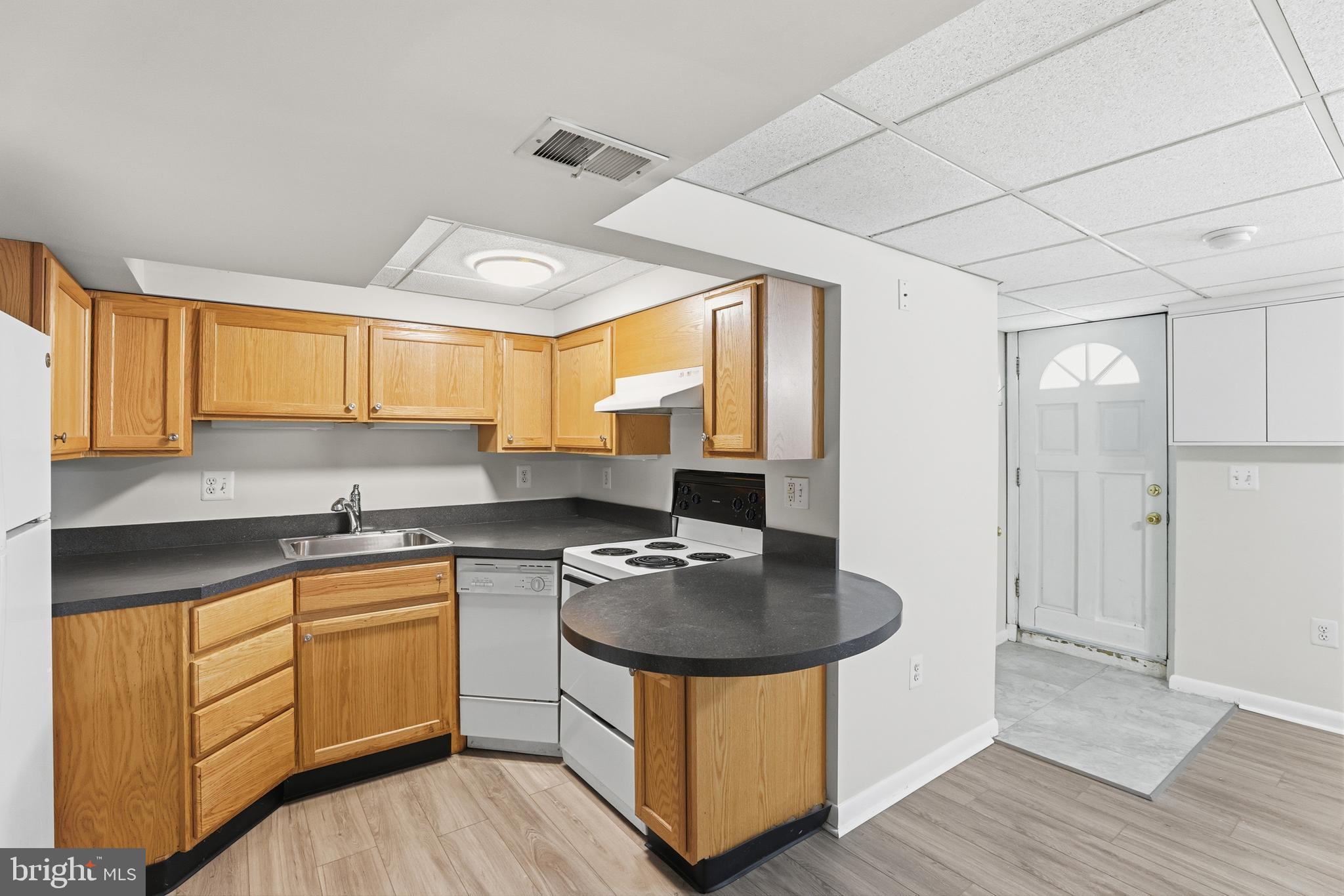 1002 Winsford Road Baltimore, MD 21204 - Photo 25 of 30 a kitchen with stainless steel appliances granite countertop a sink stove and refrigerator