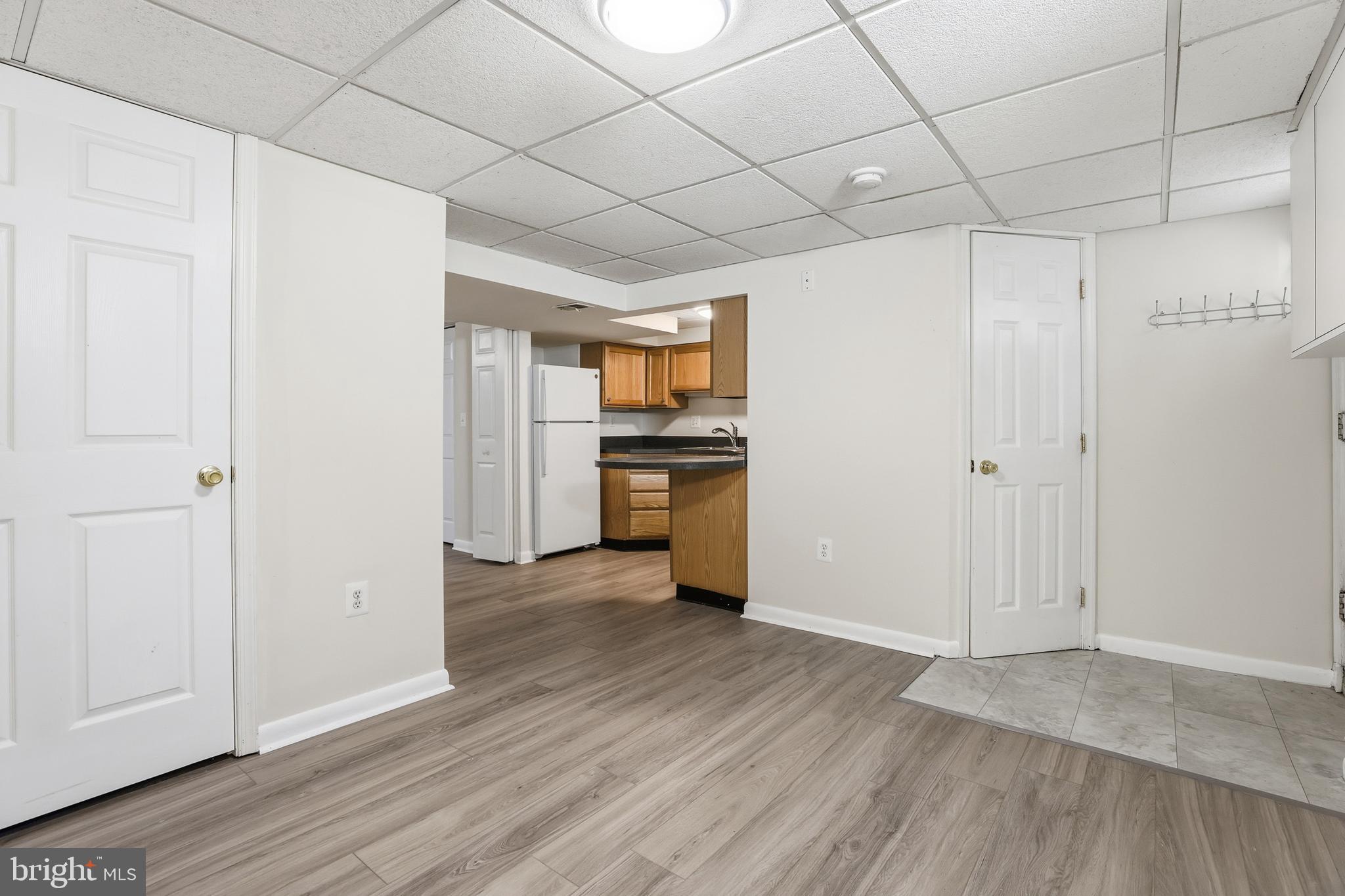 1002 Winsford Road Baltimore, MD 21204 - Photo 27 of 30 a view of a kitchen with a sink and a refrigerator