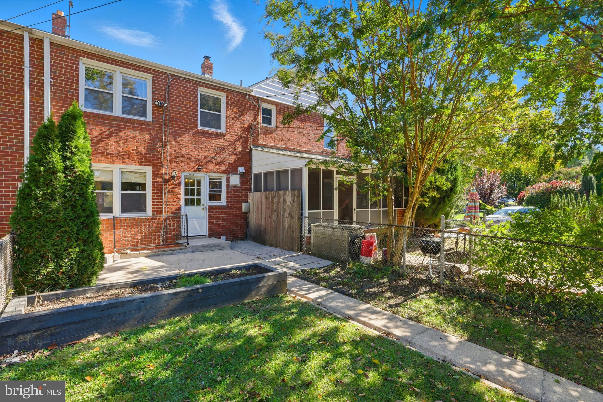 1002 Winsford Road Baltimore, MD 21204 - Photo 28 of 30 a view of a house with a small yard and a large tree