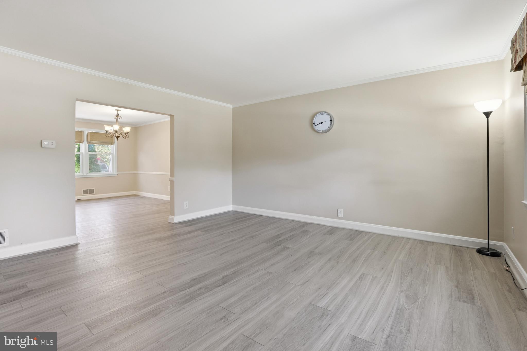 1002 Winsford Road Baltimore, MD 21204 - Photo 5 of 30 an empty room with wooden floor and windows