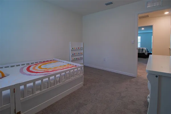 a view of a livingroom with an empty space and a window