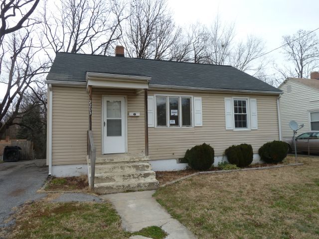 2203 Courtland Road Northeast Roanoke, VA 24012 - Photo 1 of 10 a front view of a house with a yard