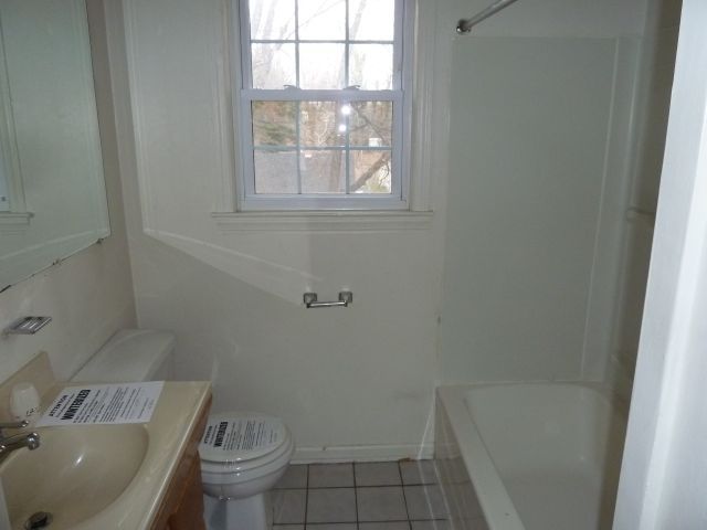 2203 Courtland Road Northeast Roanoke, VA 24012 - Photo 6 of 10 a bath room with a toilet and a sink