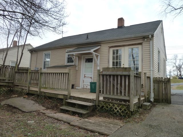 2203 Courtland Road Northeast Roanoke, VA 24012 - Photo 10 of 10 a front view of a house with a fence
