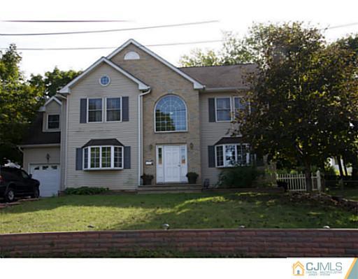 9 Halstead Road New Brunswick, NJ 08901 - Photo 1 of 24 a front view of a house with a yard