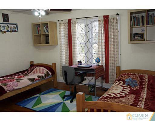 9 Halstead Road New Brunswick, NJ 08901 - Photo 20 of 24 a bedroom with furniture and a window