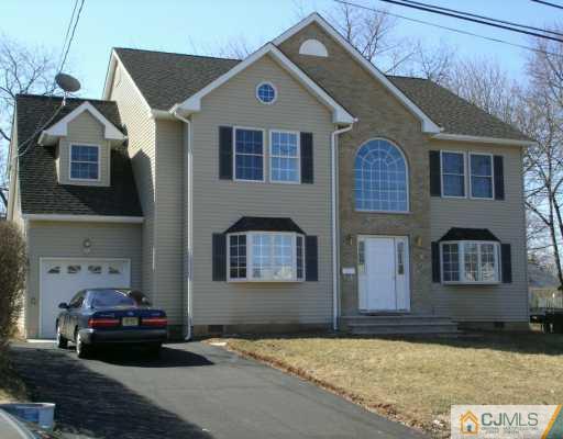 9 Halstead Road New Brunswick, NJ 08901 - Photo 2 of 24 a front view of a house with a yard