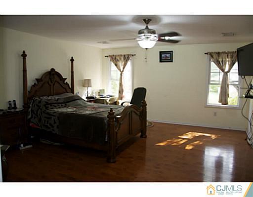9 Halstead Road New Brunswick, NJ 08901 - Photo 21 of 24 a living room with couches and chandelier