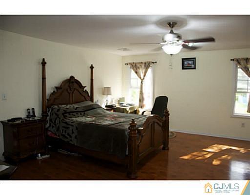 9 Halstead Road New Brunswick, NJ 08901 - Photo 22 of 24 a bed room with a bed and a television