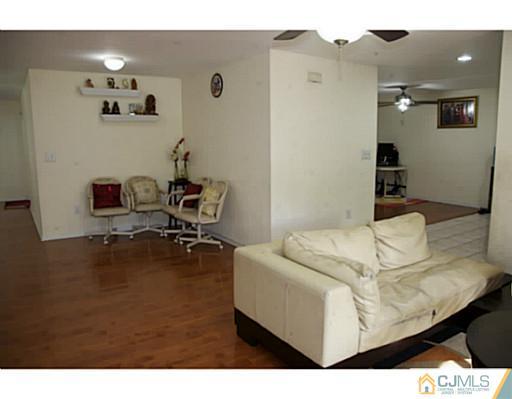 9 Halstead Road New Brunswick, NJ 08901 - Photo 5 of 24 a living room with furniture and a table