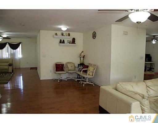 9 Halstead Road New Brunswick, NJ 08901 - Photo 6 of 24 a living room with furniture and a lamp