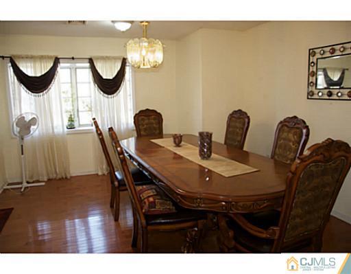 9 Halstead Road New Brunswick, NJ 08901 - Photo 7 of 24 a view of a dining room with furniture and a mirror