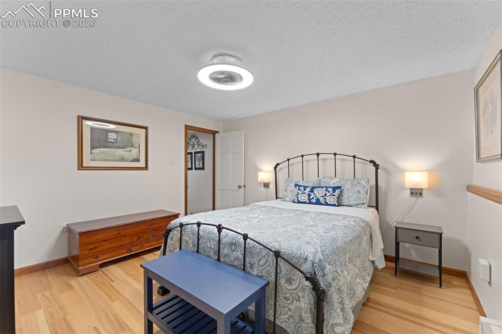 1851 Buttercup Road Elizabeth, CO 80107 - Photo 34 of 47 a bedroom with a bed and a table in it